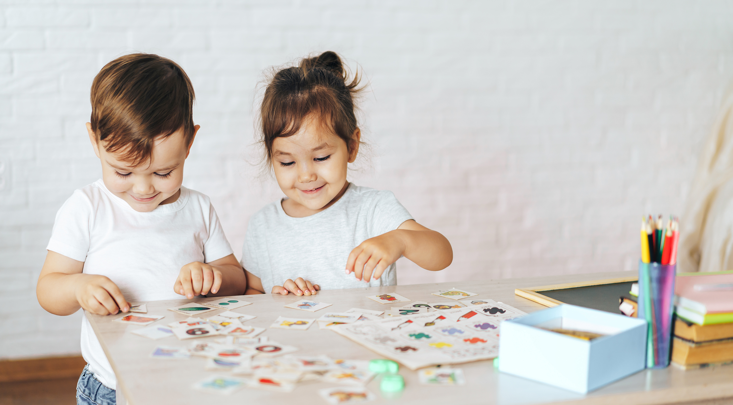 Children play educational games at the school desk